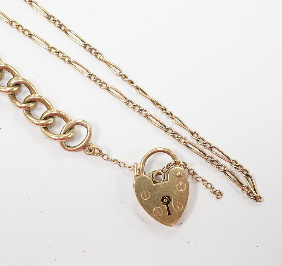 A 1970's 9ct gold curb link bracelet, with heart shaped padlock clasp, 18cm, together with a 9ct fine link chain, 10.3 grams. Fair condition.